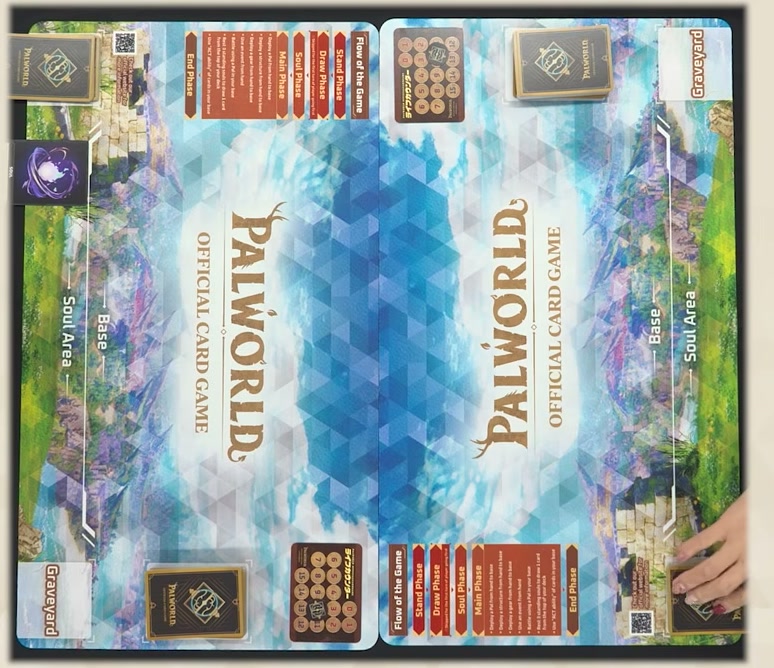 The Palworld Official Card Game playmat showing the Soul Area, Base, Deck, Soul Deck, Graveyard and the Flow of the Game phase track